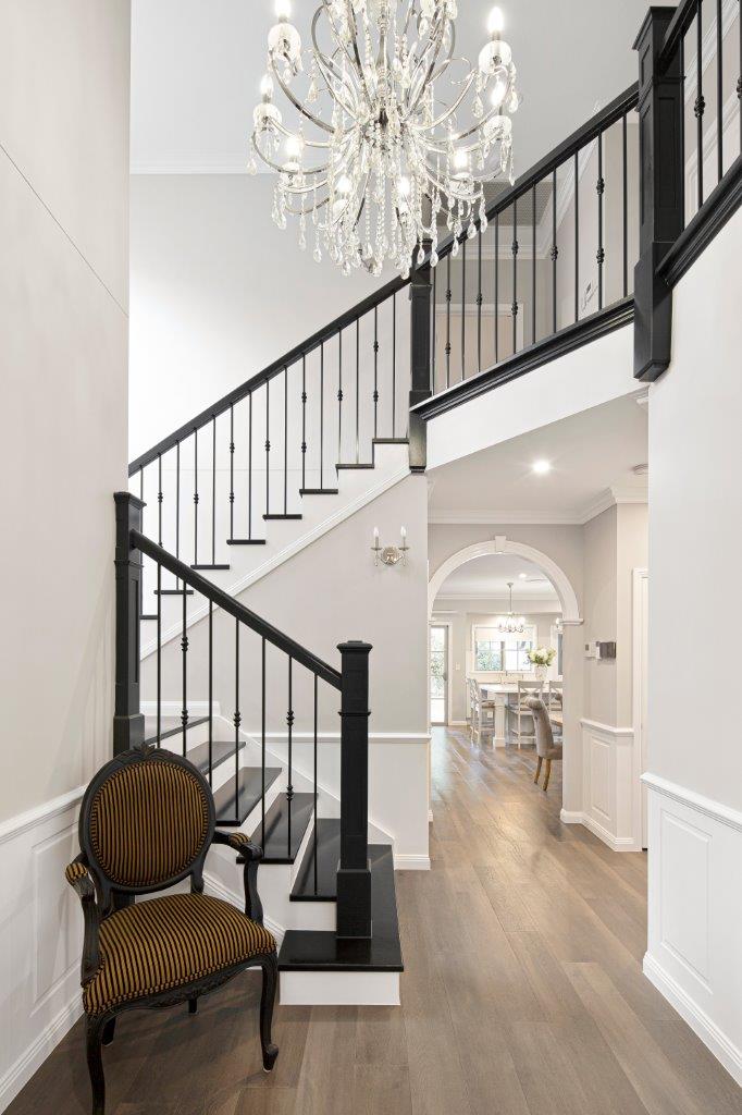 Elegant traditional staircase in grand Bridgeman Downs foyer