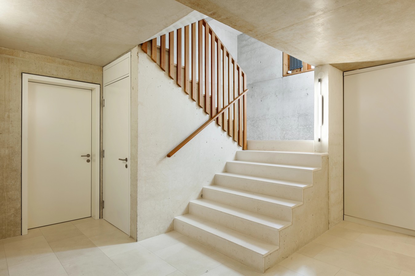 Concrete staircase with timber balustrade in Rothwell property