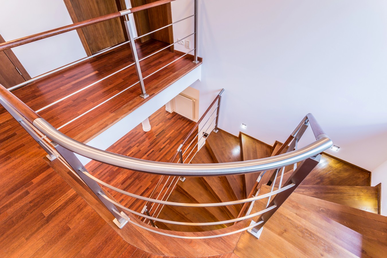 Curved hardwood staircase with steel balustrade in Caloundra home