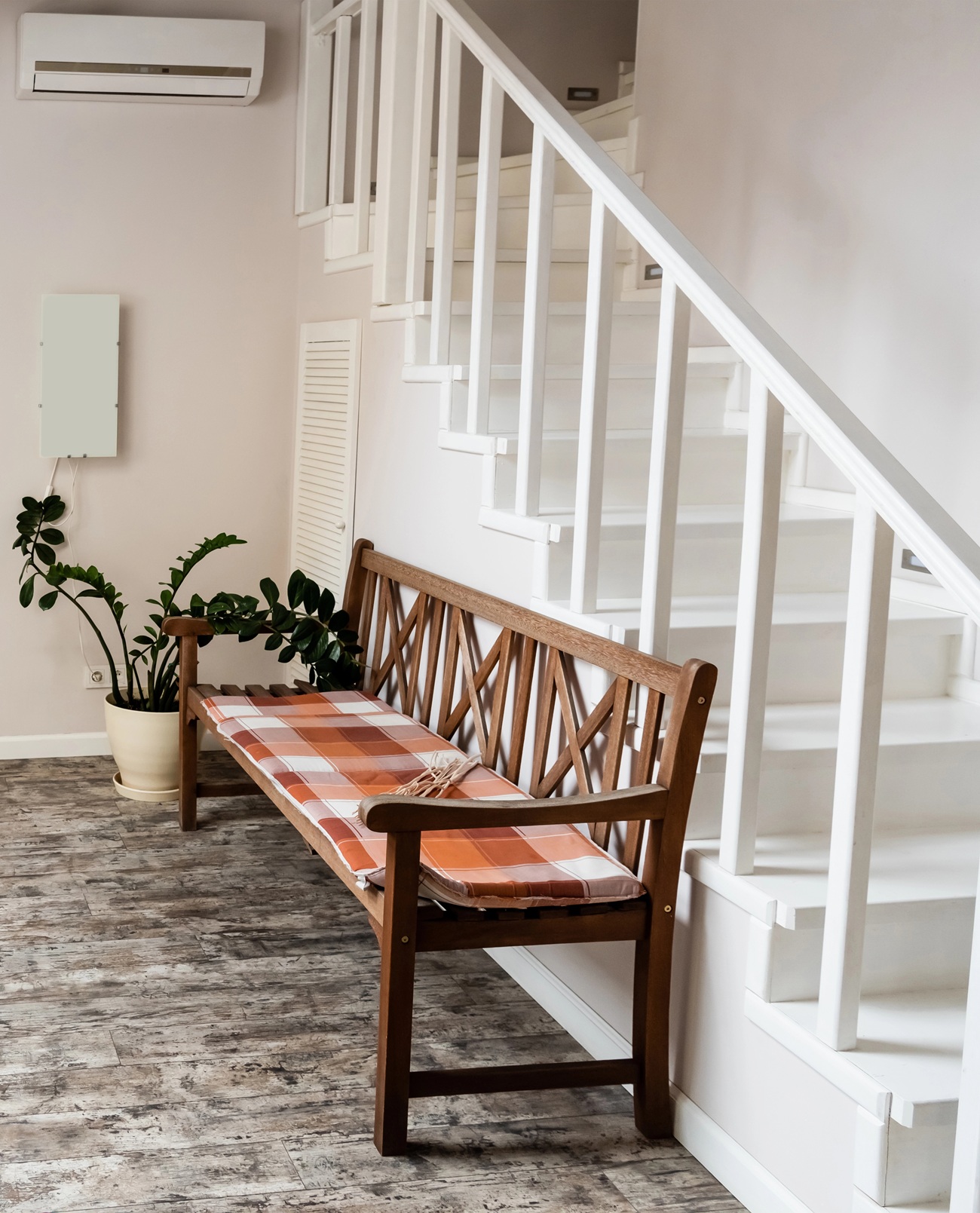 White interior staircase with timber bench seat in Petrie home