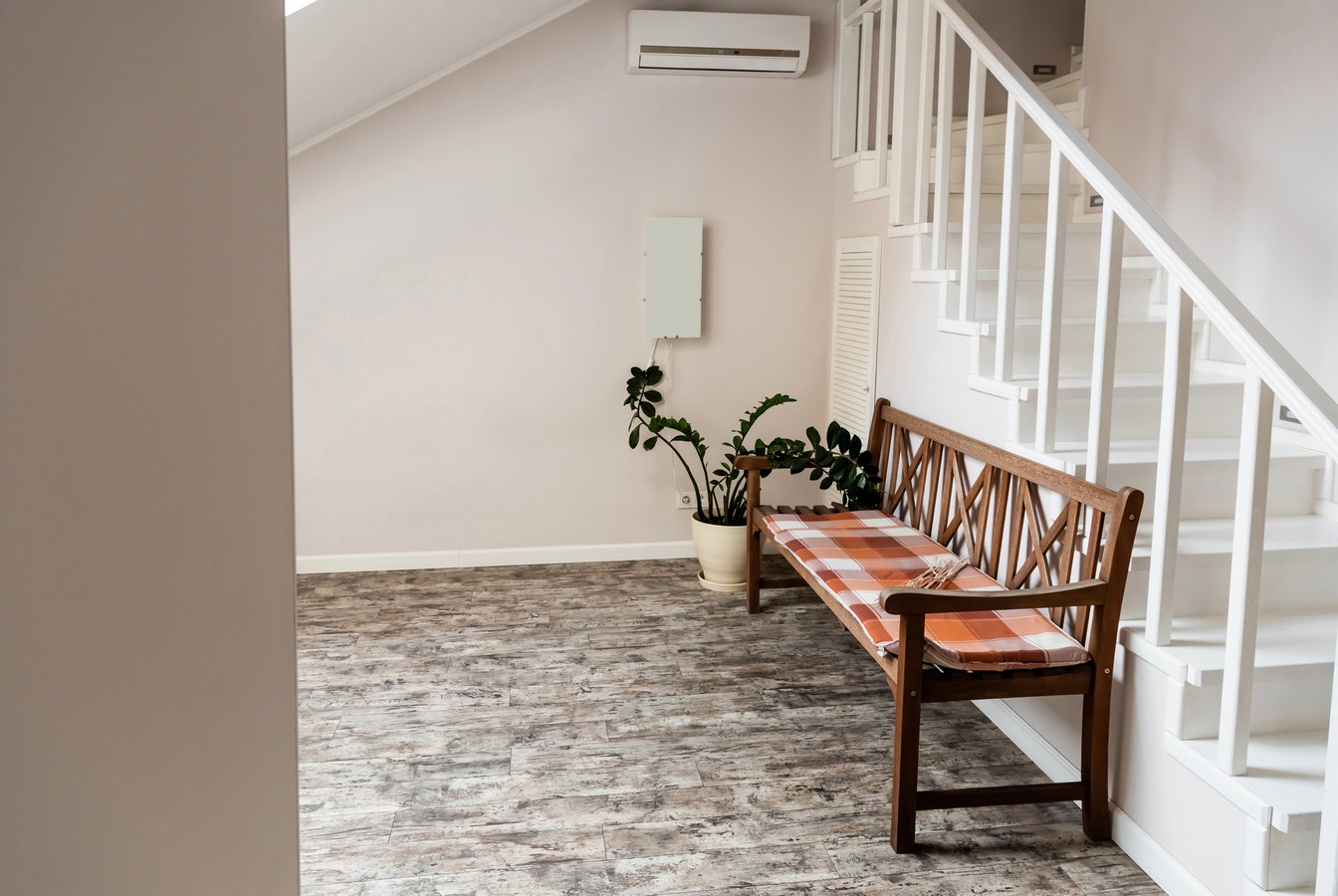 White interior staircase with under-stair storage in Kawana Waters home