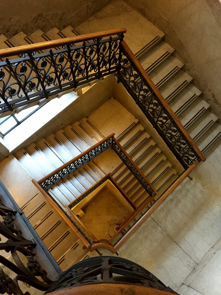 Wrought iron spiral staircase viewed from above in Mitchelton home